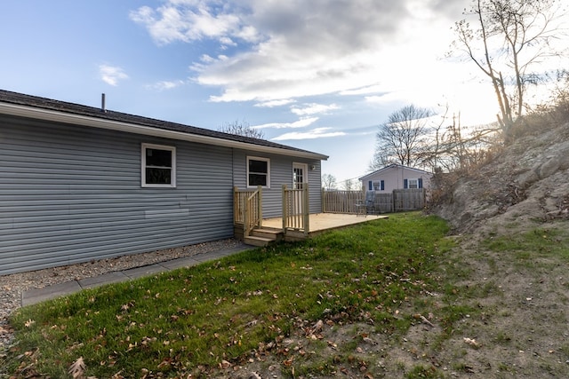 back of property featuring a lawn