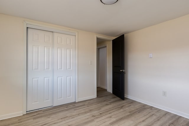 303 E Sullivanville Rd, Horseheads, NY 14845 - unfurnished bedroom featuring light wood-type flooring and a closet