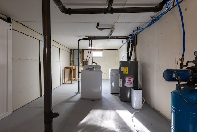 basement featuring washer / dryer and electric water heater