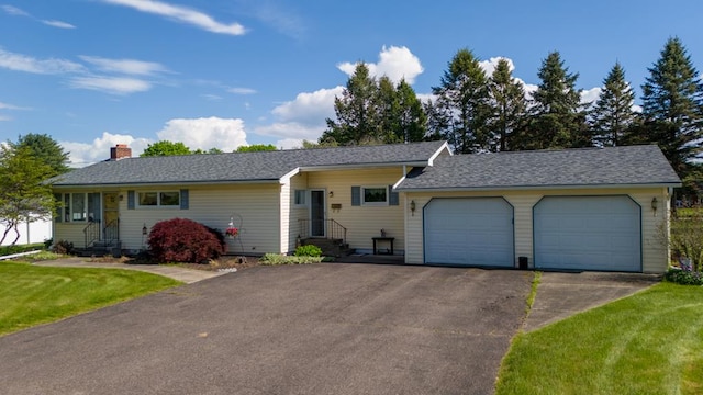 517 Mohawk St, Sayre, PA 18640 - ranch-style house featuring an attached garage, asphalt driveway, a chimney, and entry steps