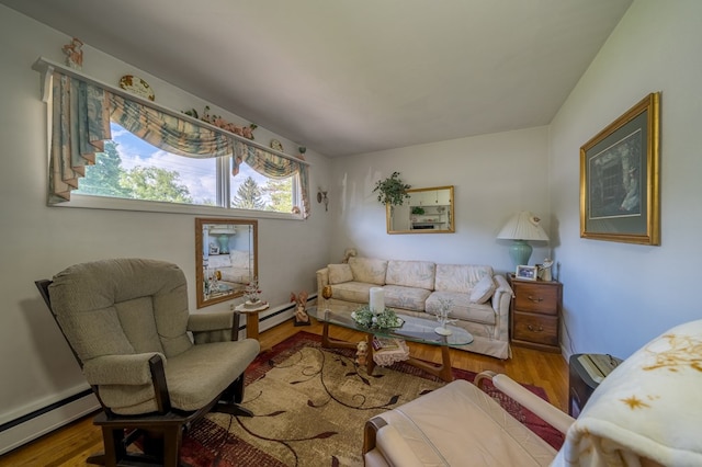 517 Mohawk St, Sayre, PA 18640 - living area with a baseboard heating unit, healthy amount of natural light, and wood finished floors