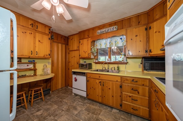 517 Mohawk St, Sayre, PA 18640 - kitchen with white appliances, a sink, brown cabinetry, and light countertops
