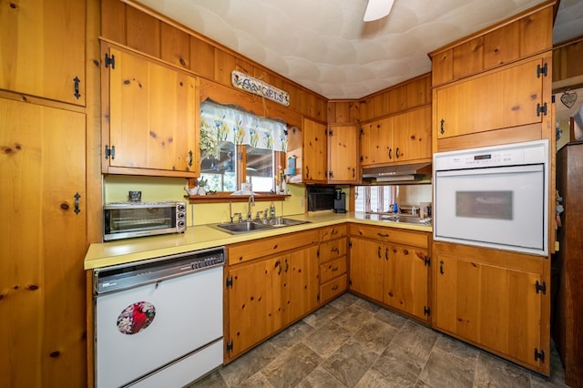 517 Mohawk St, Sayre, PA 18640 - kitchen featuring white appliances, a sink, light countertops, and brown cabinetry