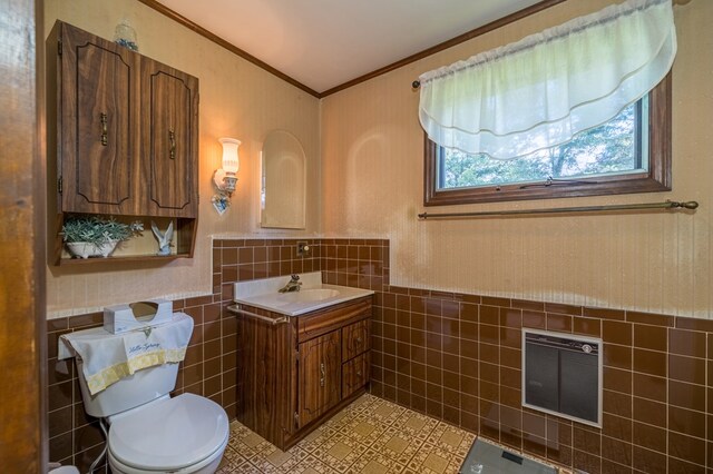 517 Mohawk St, Sayre, PA 18640 - bathroom featuring tile walls, crown molding, toilet, vanity, and a wainscoted wall