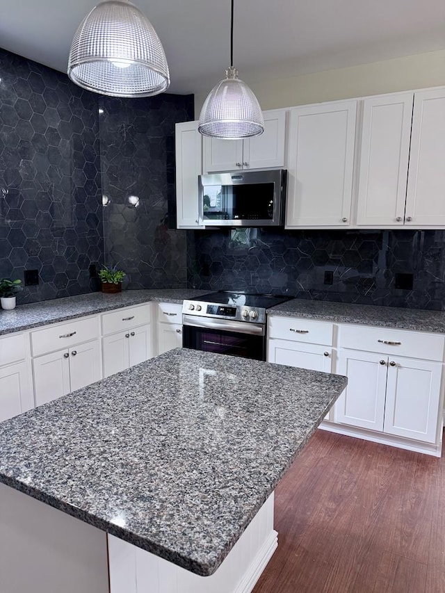 501 N Main St, Athens, PA 18810 - kitchen featuring stainless steel appliances, dark stone counters, and white cabinets