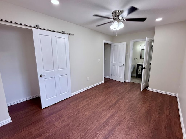 501 N Main St, Athens, PA 18810 - unfurnished bedroom featuring wood finished floors, recessed lighting, a barn door, ensuite bath, and ceiling fan