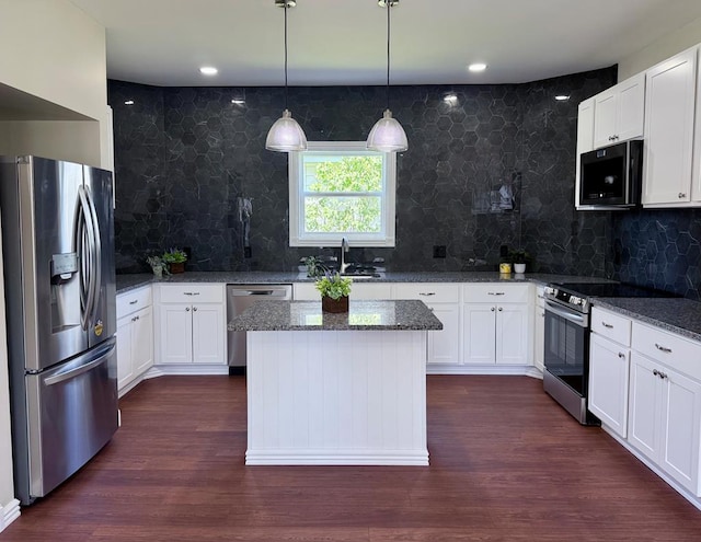 501 N Main St, Athens, PA 18810 - kitchen with appliances with stainless steel finishes, dark stone counters, backsplash, and white cabinets