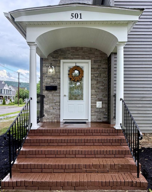 501 N Main St, Athens, PA 18810 - doorway to property featuring stone siding and a porch