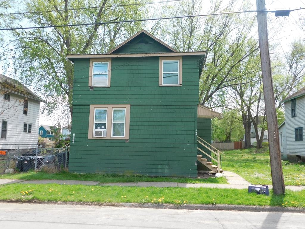 708 Pattinson St, Elmira, NY 14901 - view of front of property with stairway, fence, a front lawn, and cooling unit