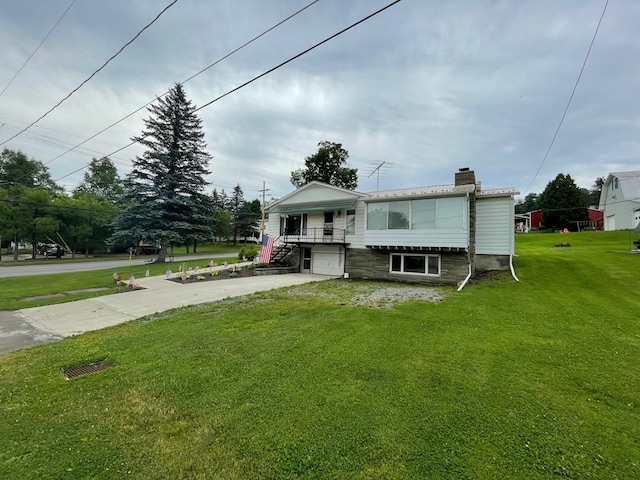 401 Center St, Ulysses, PA 16948 - view of front of property featuring driveway, a garage, a chimney, and a front lawn