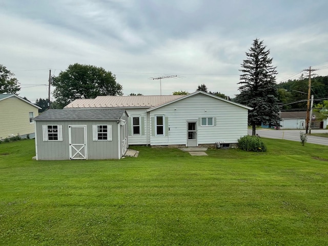 401 Center St, Ulysses, PA 16948 - rear view of house featuring a yard and an outdoor structure