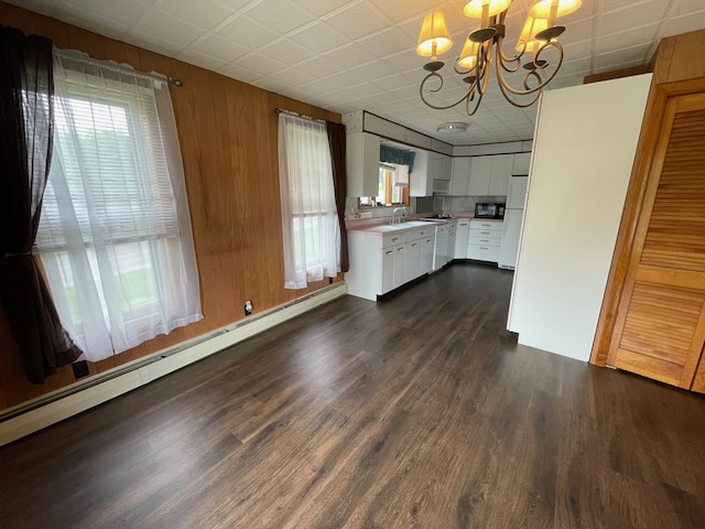 401 Center St, Ulysses, PA 16948 - kitchen with a chandelier, white cabinetry, light countertops, dark wood-style floors, and a baseboard radiator