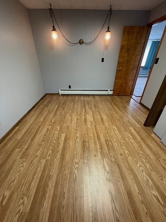 401 Center St, Ulysses, PA 16948 - unfurnished dining area featuring a baseboard heating unit and light wood-style floors