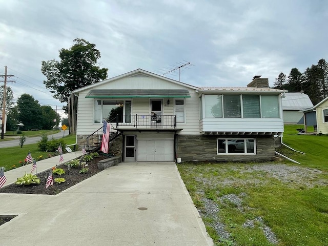 401 Center St, Ulysses, PA 16948 - view of front of home featuring an attached garage, concrete driveway, a front yard, stairway, and stone siding