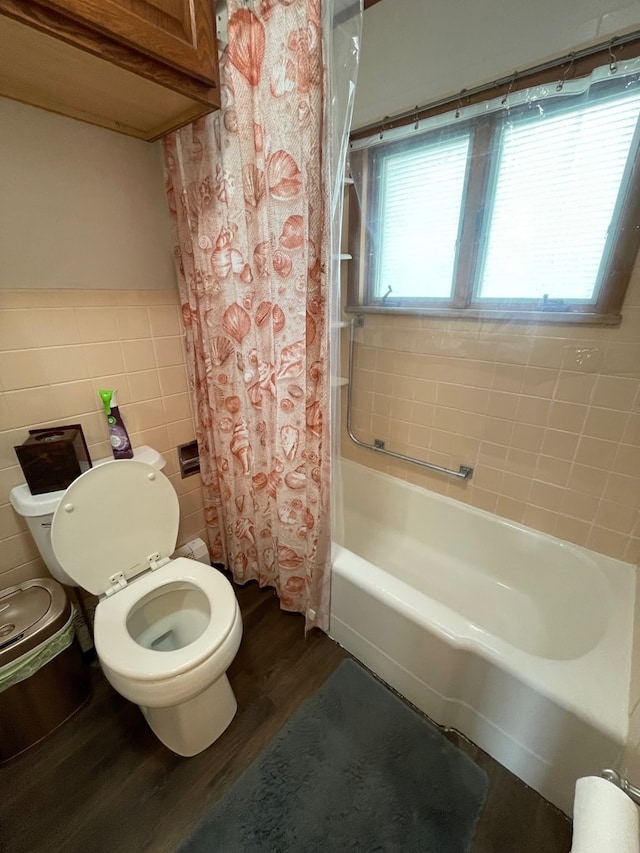 401 Center St, Ulysses, PA 16948 - bathroom with wood finished floors, tile walls, and shower / tub combo with curtain