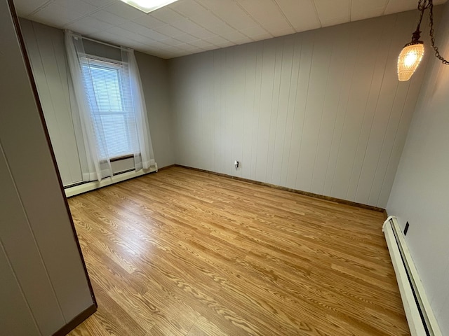 401 Center St, Ulysses, PA 16948 - empty room featuring a baseboard heating unit and light wood-style floors