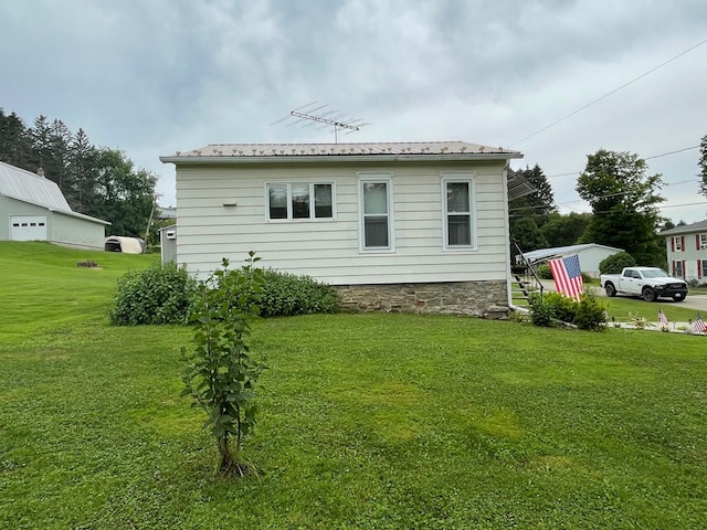 401 Center St, Ulysses, PA 16948 - back of property with a lawn and a metal roof