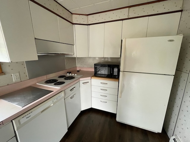 401 Center St, Ulysses, PA 16948 - kitchen with white appliances, dark wood finished floors, a baseboard radiator, wallpapered walls, and light countertops