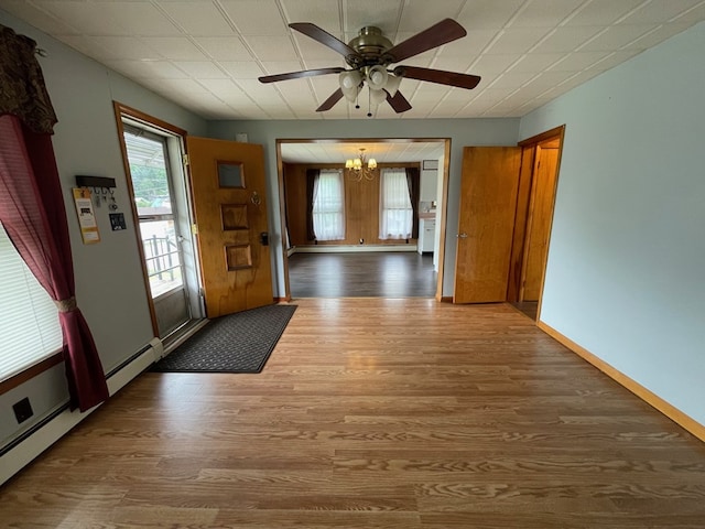 401 Center St, Ulysses, PA 16948 - entrance foyer with a chandelier, wood finished floors, and a ceiling fan