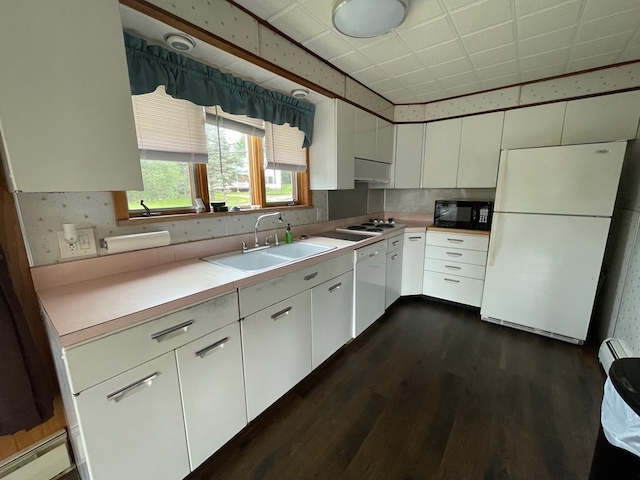 401 Center St, Ulysses, PA 16948 - kitchen featuring white appliances, dark wood-style flooring, white cabinetry, light countertops, and exhaust hood