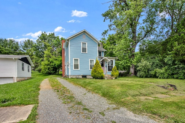 40 Wetmore St, Wellsboro, PA 16901 - view of front facade with a front lawn, driveway, and a porch