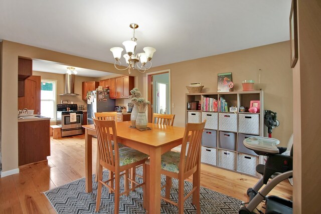 40 Wetmore St, Wellsboro, PA 16901 - dining space with a chandelier and light wood-style flooring
