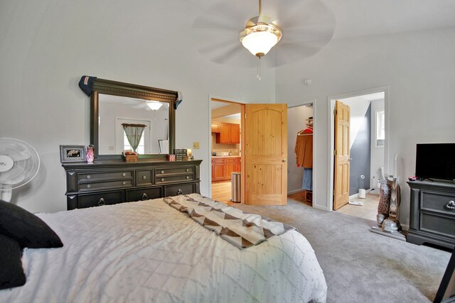 40 Wetmore St, Wellsboro, PA 16901 - tiled bedroom with a walk in closet, carpet flooring, connected bathroom, and a ceiling fan