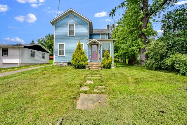 40 Wetmore St, Wellsboro, PA 16901 - view of front of home with a chimney and a front yard