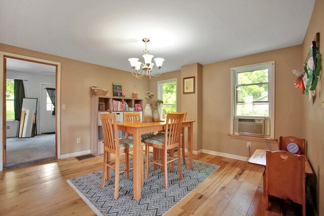 40 Wetmore St, Wellsboro, PA 16901 - dining area featuring a chandelier, light wood-type flooring, and cooling unit