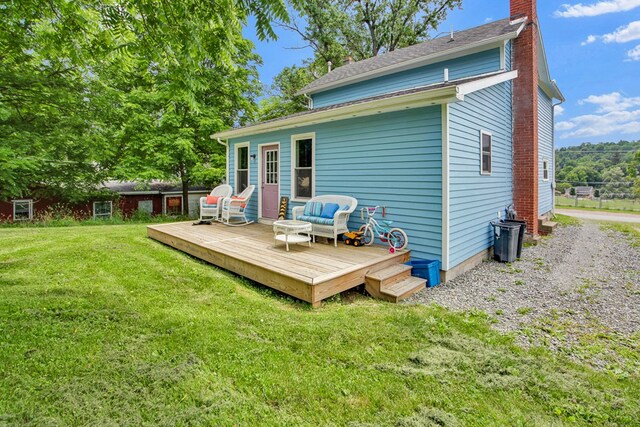 40 Wetmore St, Wellsboro, PA 16901 - back of house with a chimney, a deck, a yard, and outdoor lounge area
