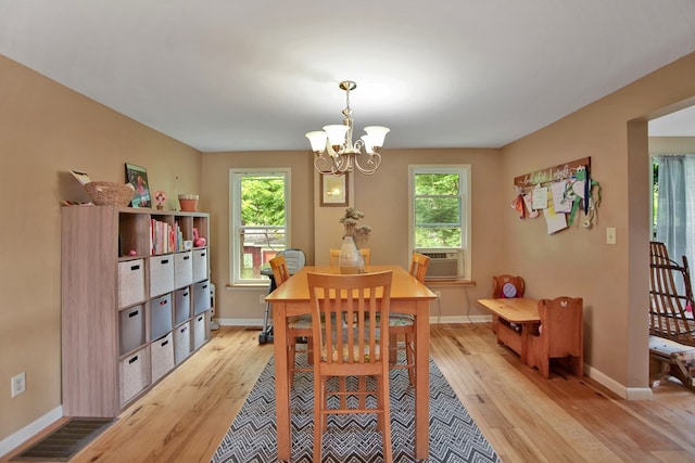 40 Wetmore St, Wellsboro, PA 16901 - dining space with light wood-type flooring, a chandelier, and cooling unit