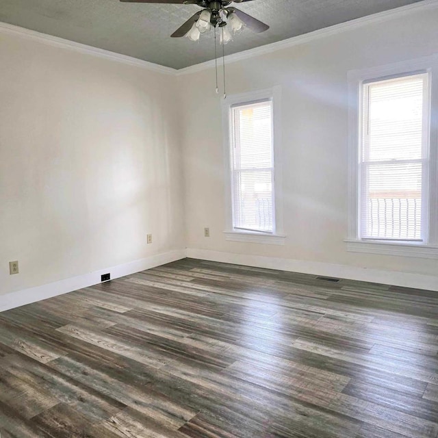 unfurnished room featuring ceiling fan, ornamental molding, and dark wood-type flooring