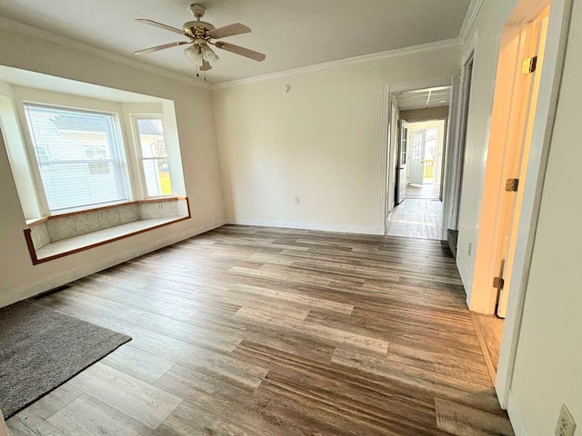 spare room with ceiling fan, hardwood / wood-style flooring, and ornamental molding