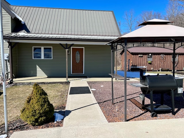 view of front of home with a gazebo and a patio area