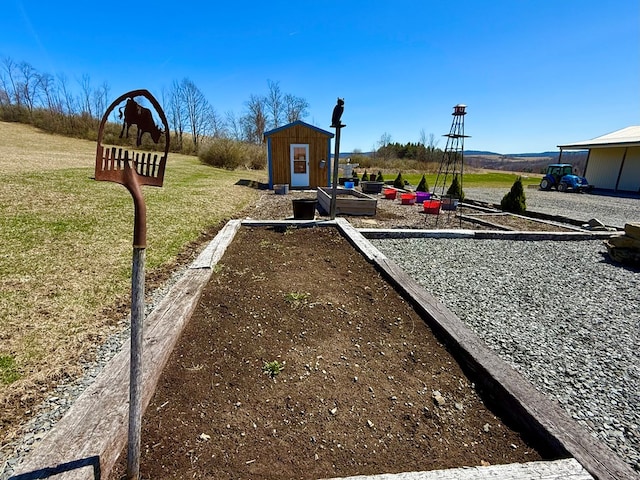 view of play area with an outdoor structure, a yard, and a storage shed