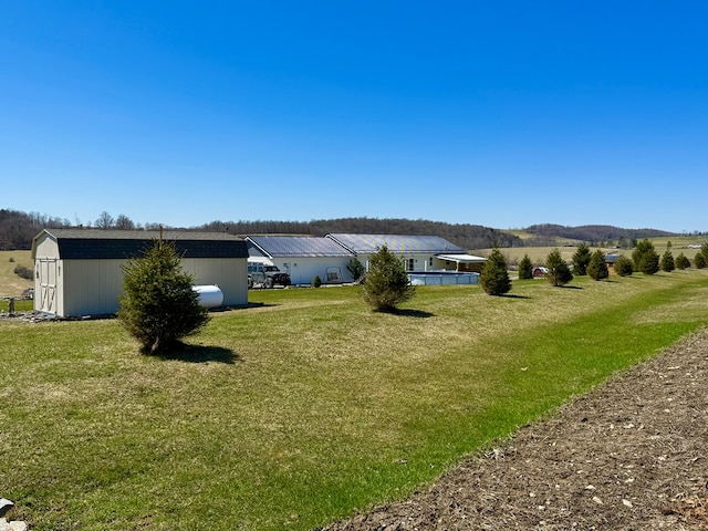exterior space with an outdoor structure and a storage shed
