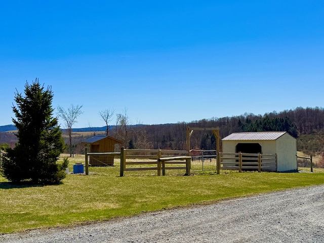 exterior space with a wooded view