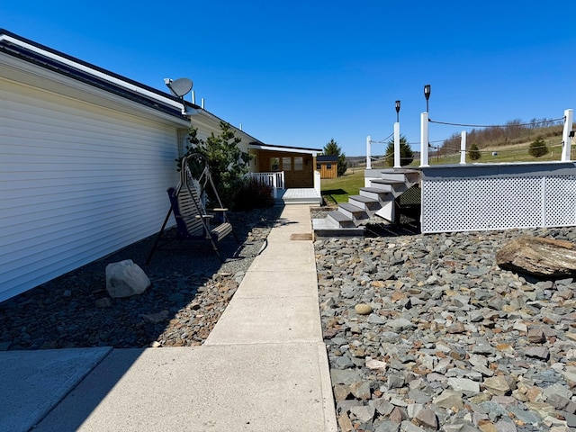 view of side of property with stairs