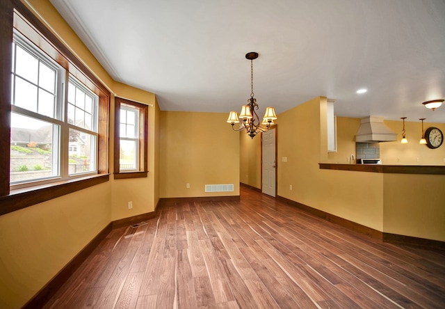77 Hunters Trl, Wellsboro, PA 16901 - unfurnished living room with a chandelier, wood finished floors, baseboards, and recessed lighting