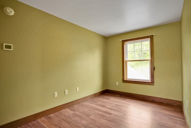 77 Hunters Trl, Wellsboro, PA 16901 - empty room with wood finished floors, baseboards, and a smoke detector