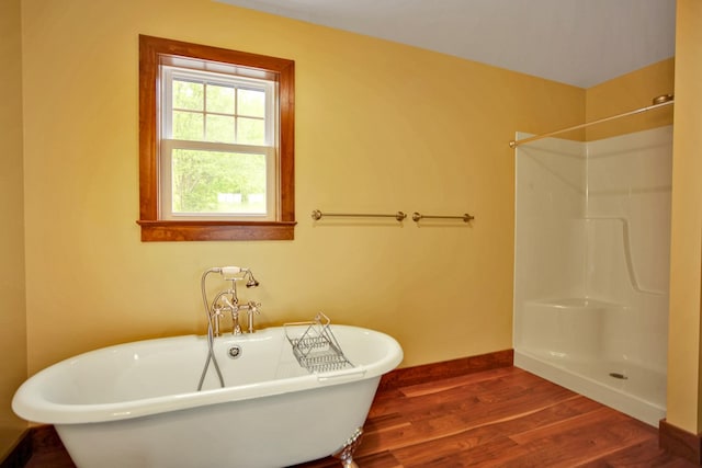 77 Hunters Trl, Wellsboro, PA 16901 - bathroom featuring wood finished floors, a freestanding bath, baseboards, and a shower