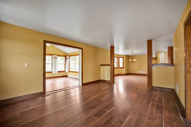 77 Hunters Trl, Wellsboro, PA 16901 - unfurnished living room featuring a chandelier, dark wood-type flooring, baseboards, and lofted ceiling