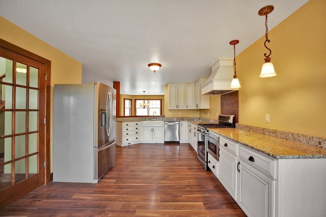 77 Hunters Trl, Wellsboro, PA 16901 - kitchen featuring stainless steel appliances, premium range hood, dark wood finished floors, hanging light fixtures, and light stone countertops