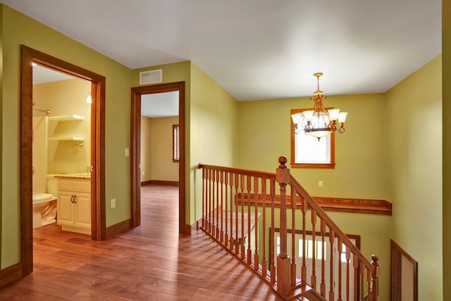 77 Hunters Trl, Wellsboro, PA 16901 - hallway with an upstairs landing, wood finished floors, a chandelier, and baseboards