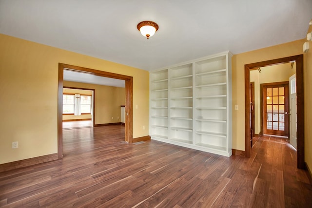 77 Hunters Trl, Wellsboro, PA 16901 - unfurnished room featuring dark wood-type flooring, baseboards, and built in features