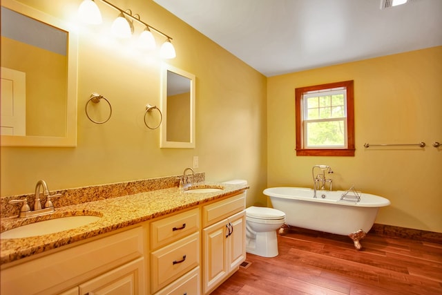 77 Hunters Trl, Wellsboro, PA 16901 - full bath with wood finished floors, a freestanding bath, double vanity, and toilet
