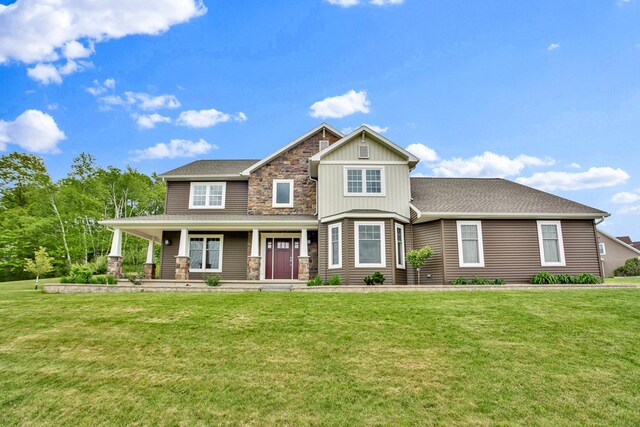 77 Hunters Trl, Wellsboro, PA 16901 - craftsman inspired home featuring stone siding, a front yard, covered porch, board and batten siding, and a shingled roof