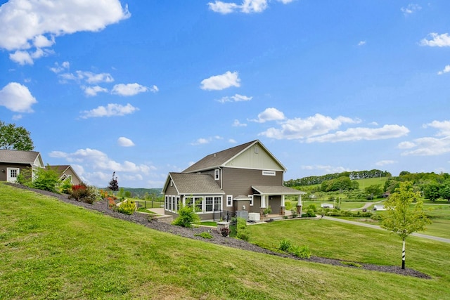 77 Hunters Trl, Wellsboro, PA 16901 - back of property with a lawn and a patio area
