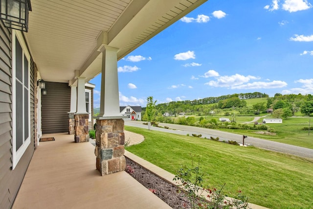 77 Hunters Trl, Wellsboro, PA 16901 - porch featuring a lawn and view of wooded area