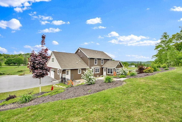 77 Hunters Trl, Wellsboro, PA 16901 - back of property featuring a yard, driveway, and roof with shingles